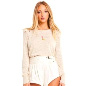 Wildflower distressed sweater with ruffle trim and embroidered flower